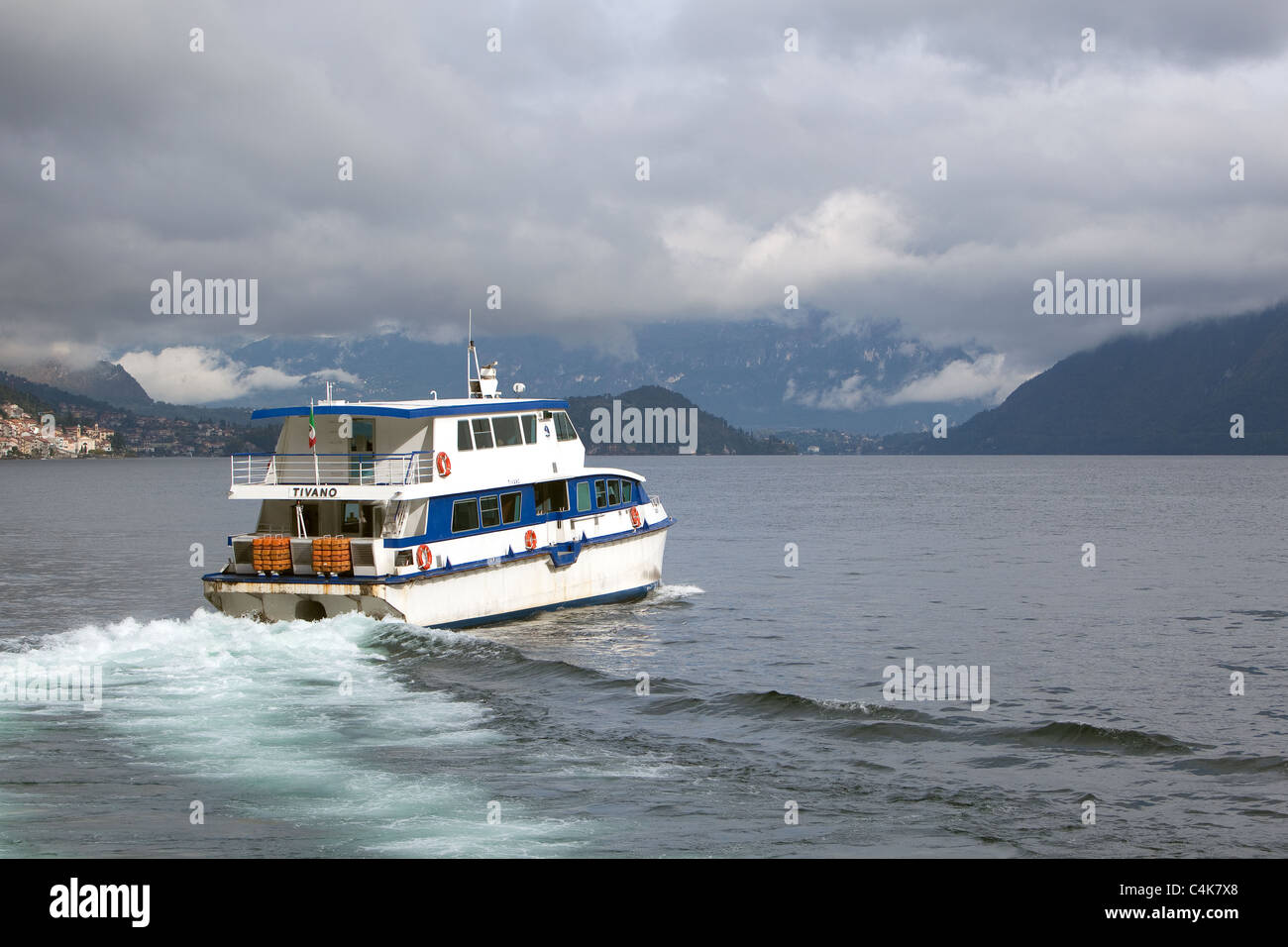Ferry sailing Argegno Lake Como into rainy weather. Italy Stock Photo