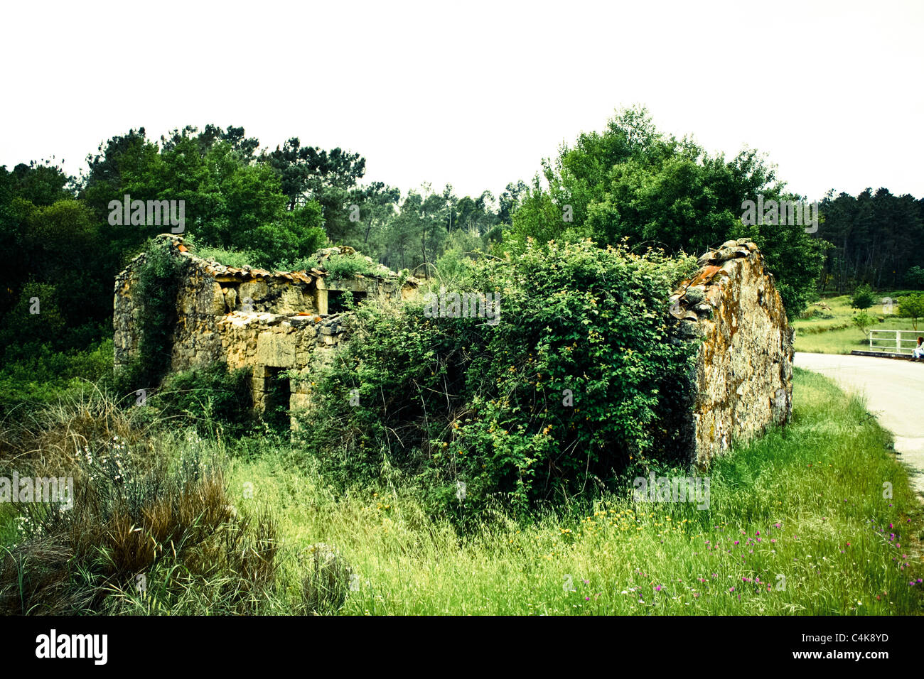 An old abandoned house close to a newly built road. Stock Photo