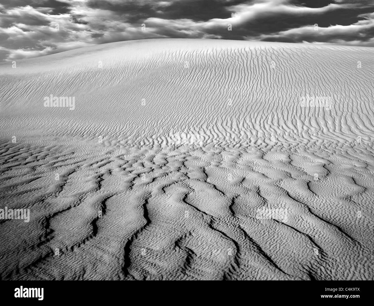 Wind ripples in sand dunes. Death Valley National Park, California. Sky was added Stock Photo