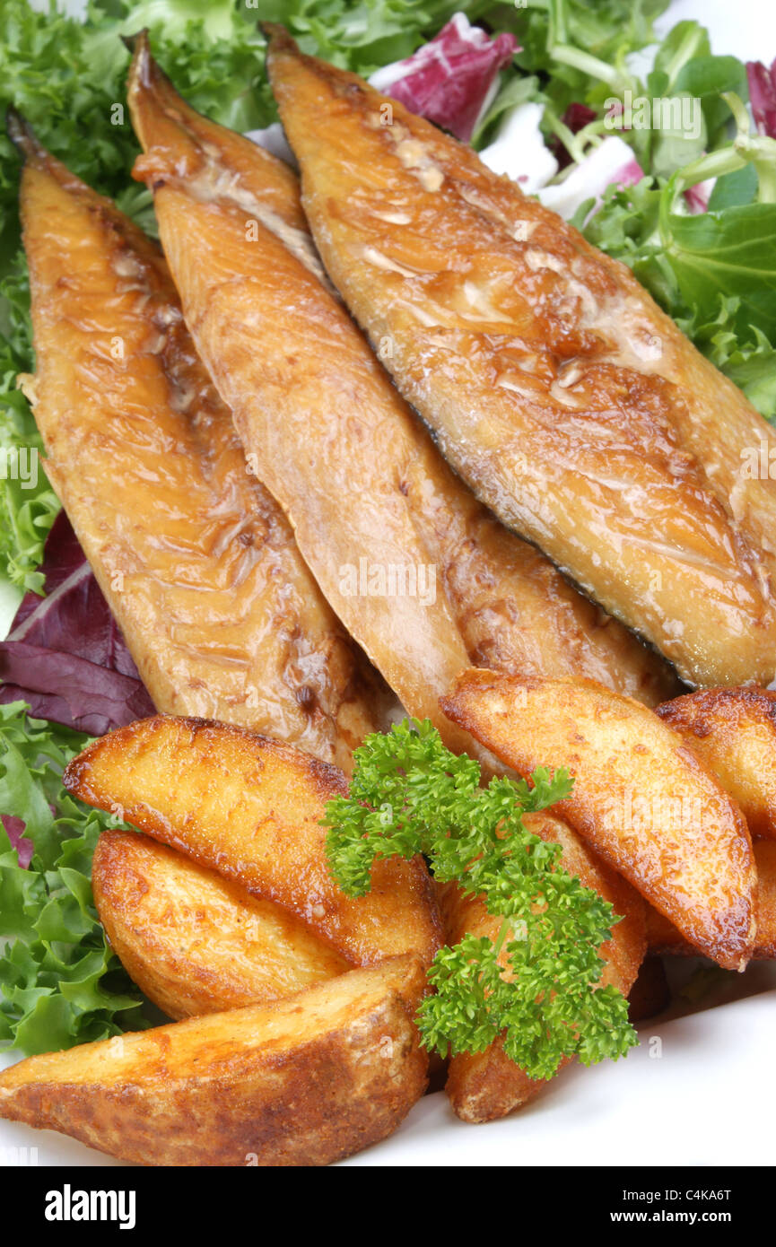 smoked mackerel fillets with grilled potato wedges Stock Photo Alamy