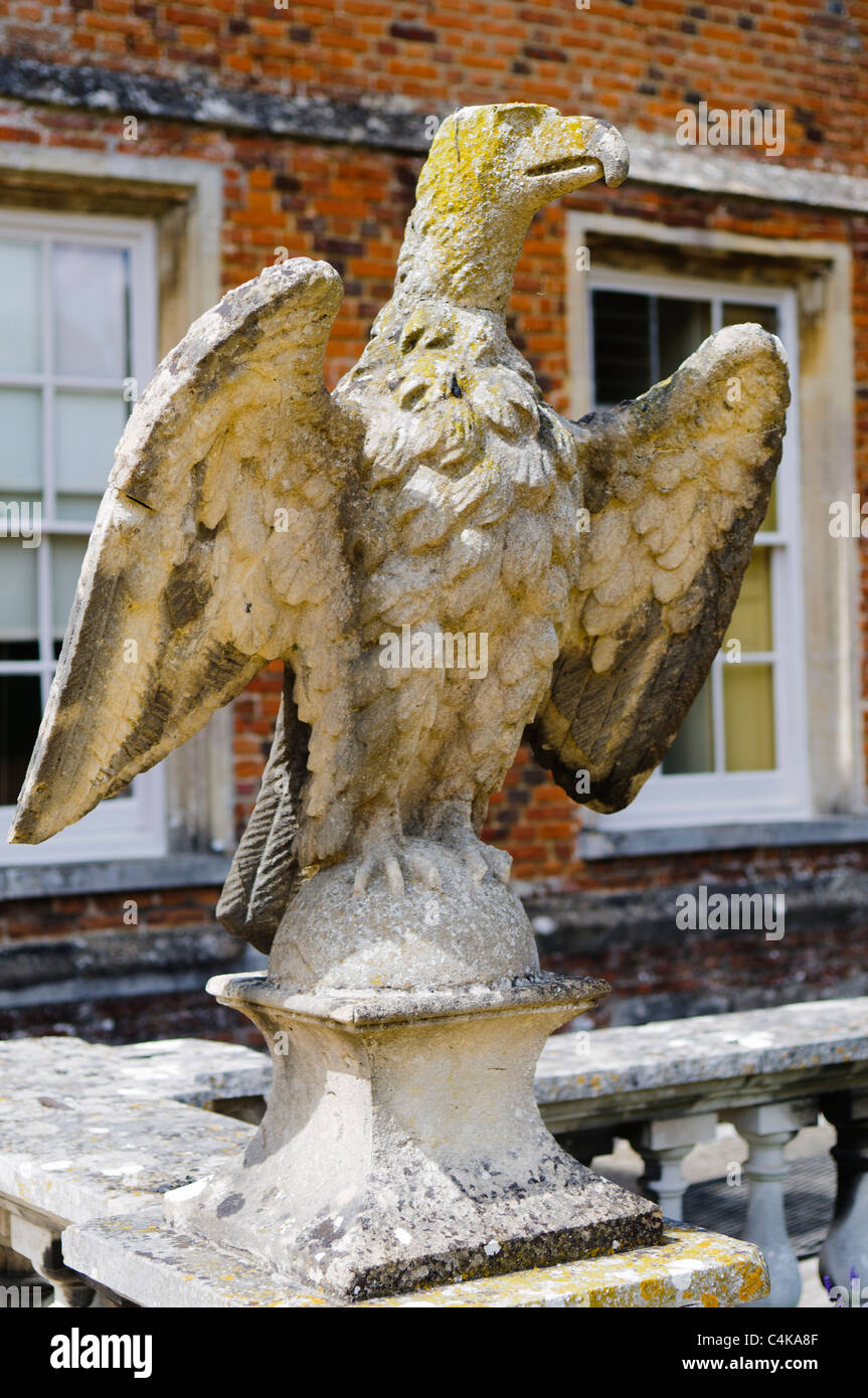 Stone eagle at the entrance to an old house Stock Photo
