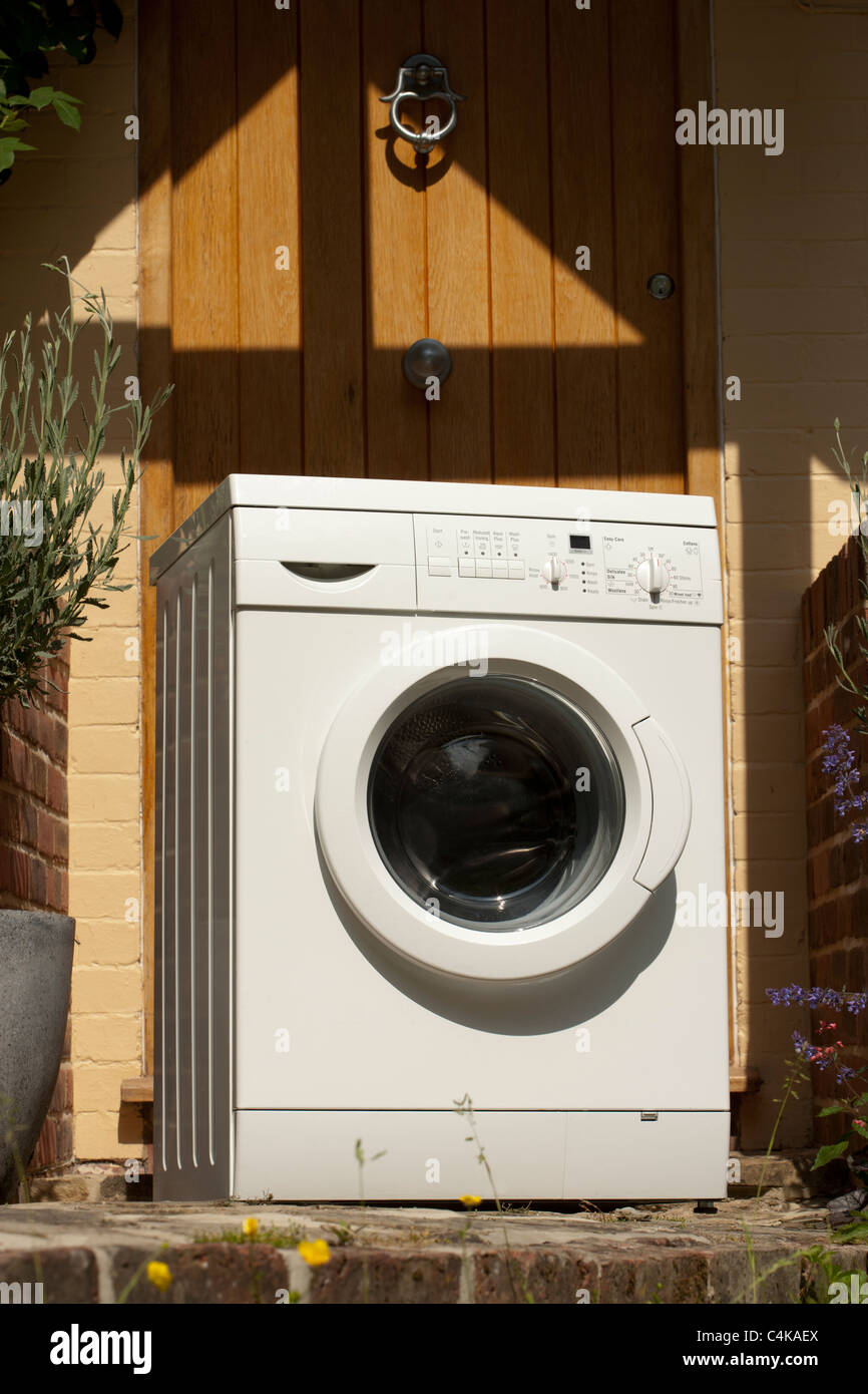 Washing machine delivered outside the house Stock Photo Alamy