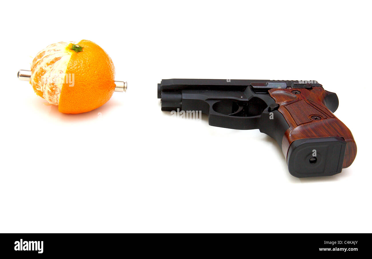 The close up of a pistol Rakes a tangerine is isolated on a white background Stock Photo