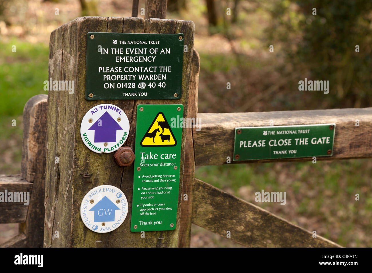 gatepost notices and warning signs for animals and national trust Stock Photo