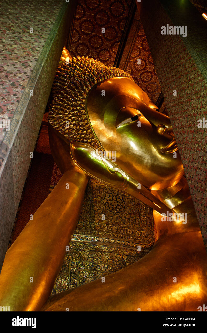Reclining Buddha at Wat Pho, 46 meters long and 15 meters high, Bangkok, Thailand. Stock Photo