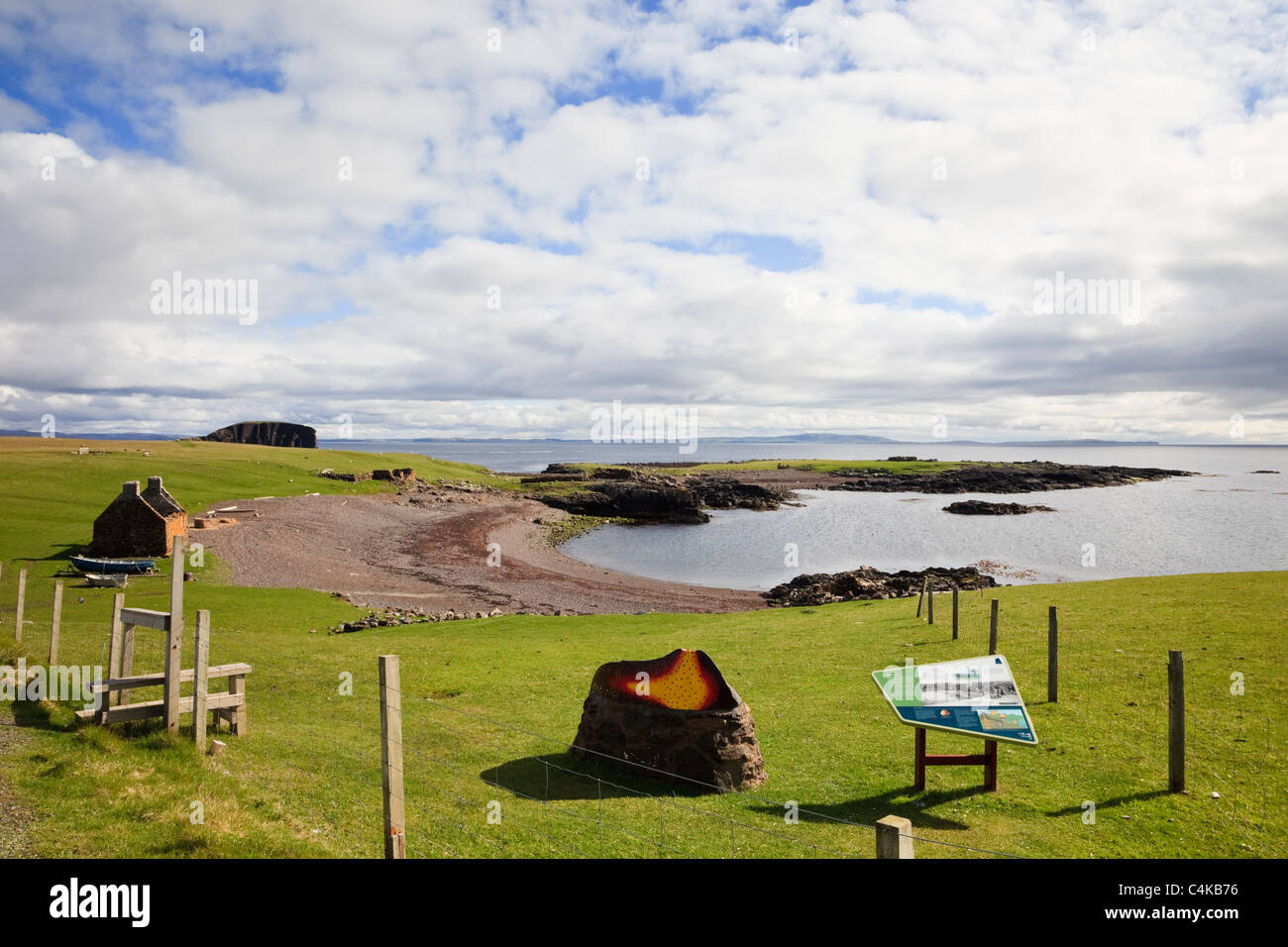 Stenness, Eshaness, Shetland Islands, Scotland, UK. Tourist information at old Haaf station with fishing lodges around bay Stock Photo
