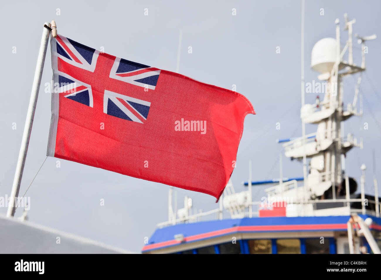 UK, Britain. Red Royal Ensign flag on a Merchant Navy vessel Stock Photo
