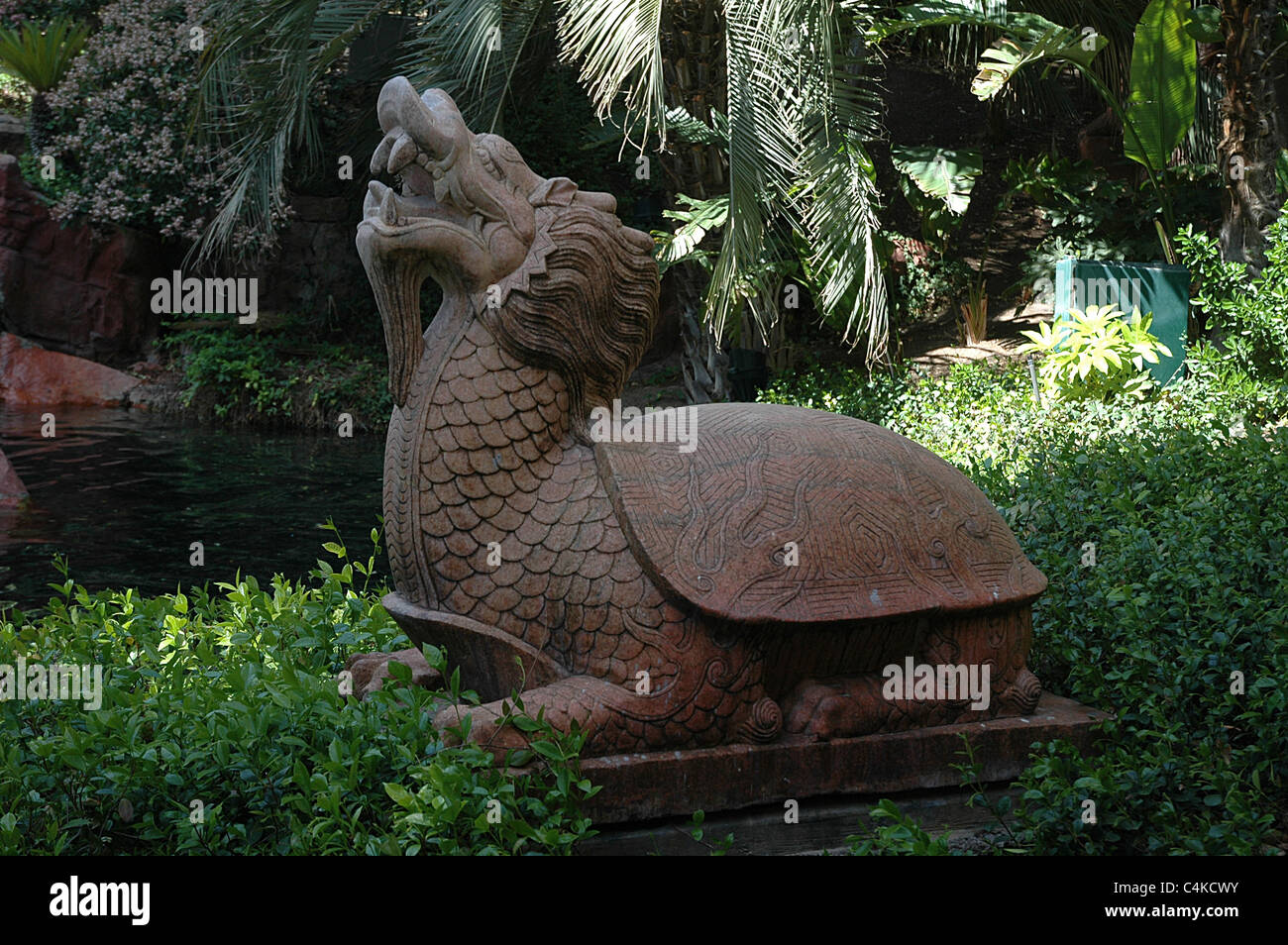 A Chinese Dragon Turtle Garden Statue Decorates The Gardens Near