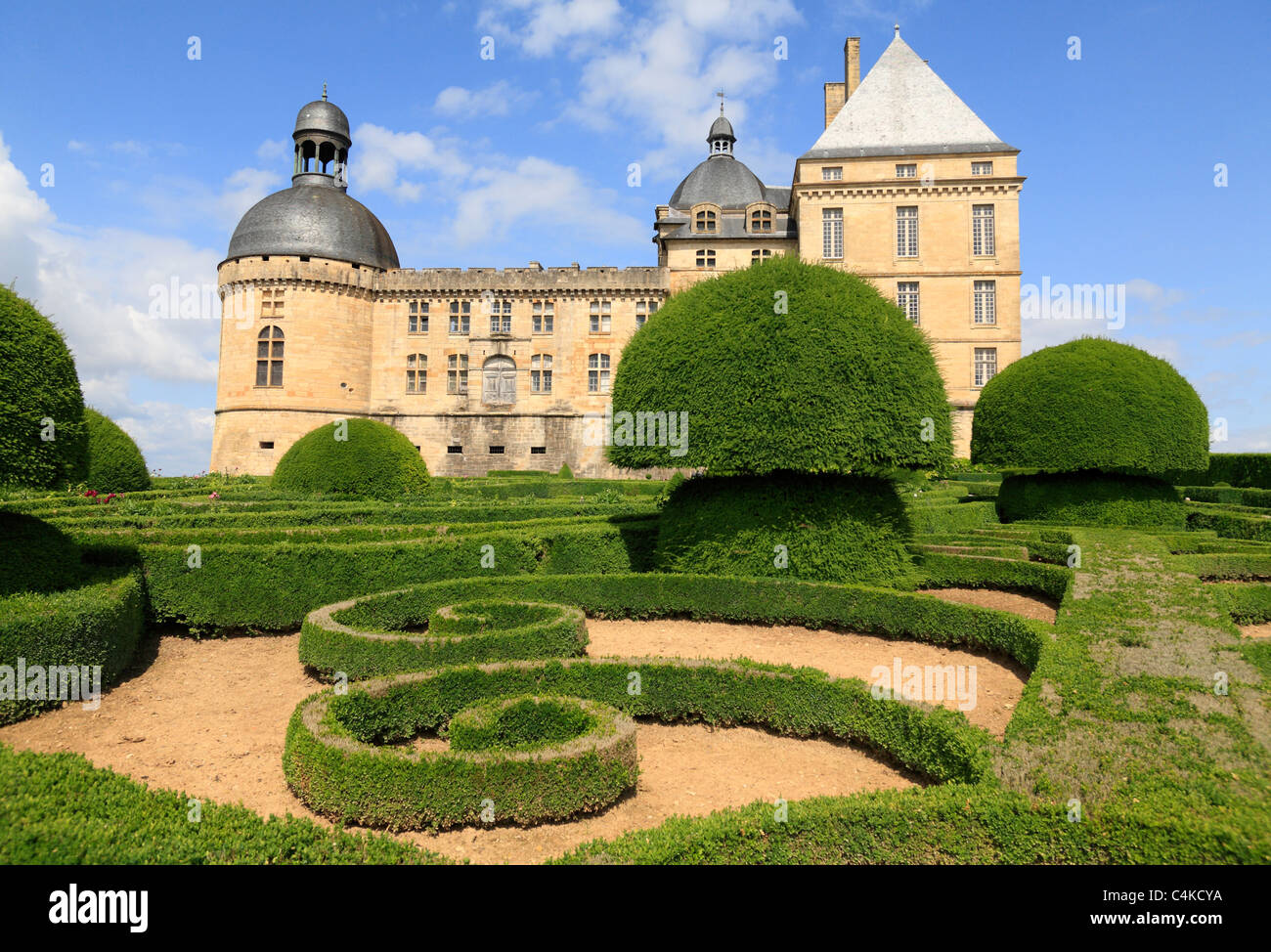 Formal French gardens with geometric Box hedges and topiary Renaiissance Chateau de Hautefort Dordogne Aquitaine France Stock Photo