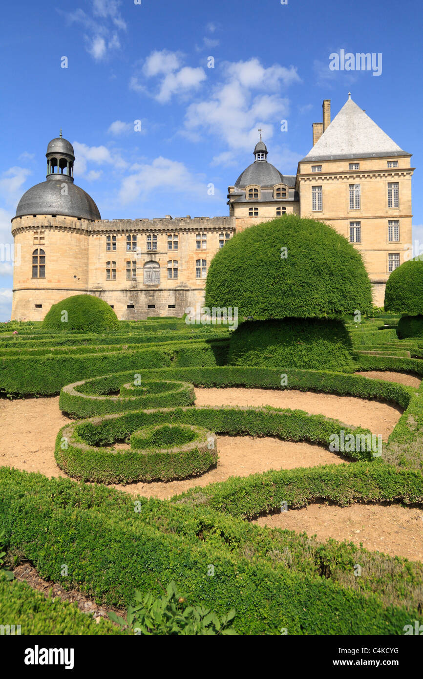 Formal French gardens with geometric Box hedges and topiary Renaiissance Chateau de Hautefort Dordogne Aquitaine France Stock Photo