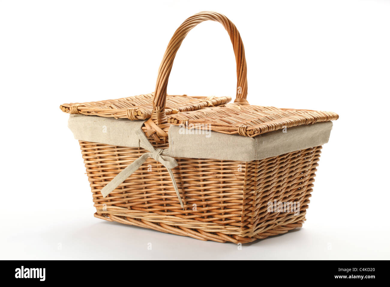 Wicker picnic basket on white background. Stock Photo