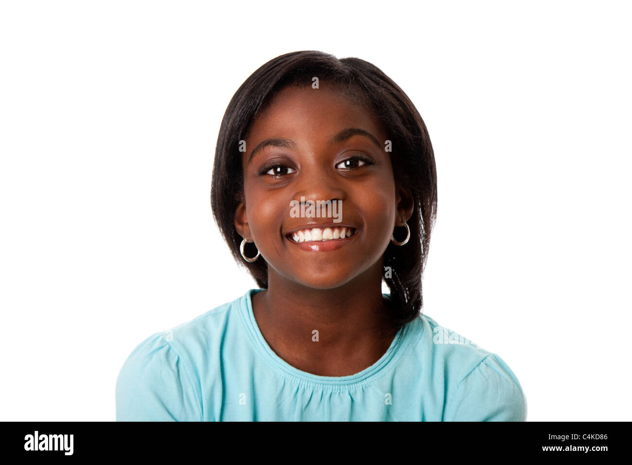Beautiful smiling face of a happy African teenager girl, isolated. Stock Photo