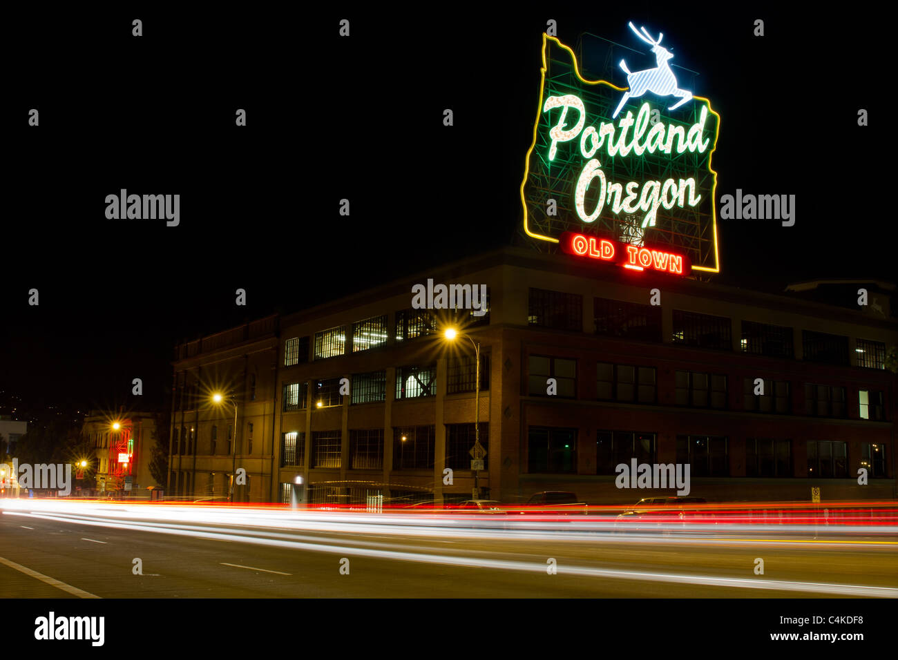 Historic Landmark Portland Oregon Old Town Sign and Light Trails Stock Photo
