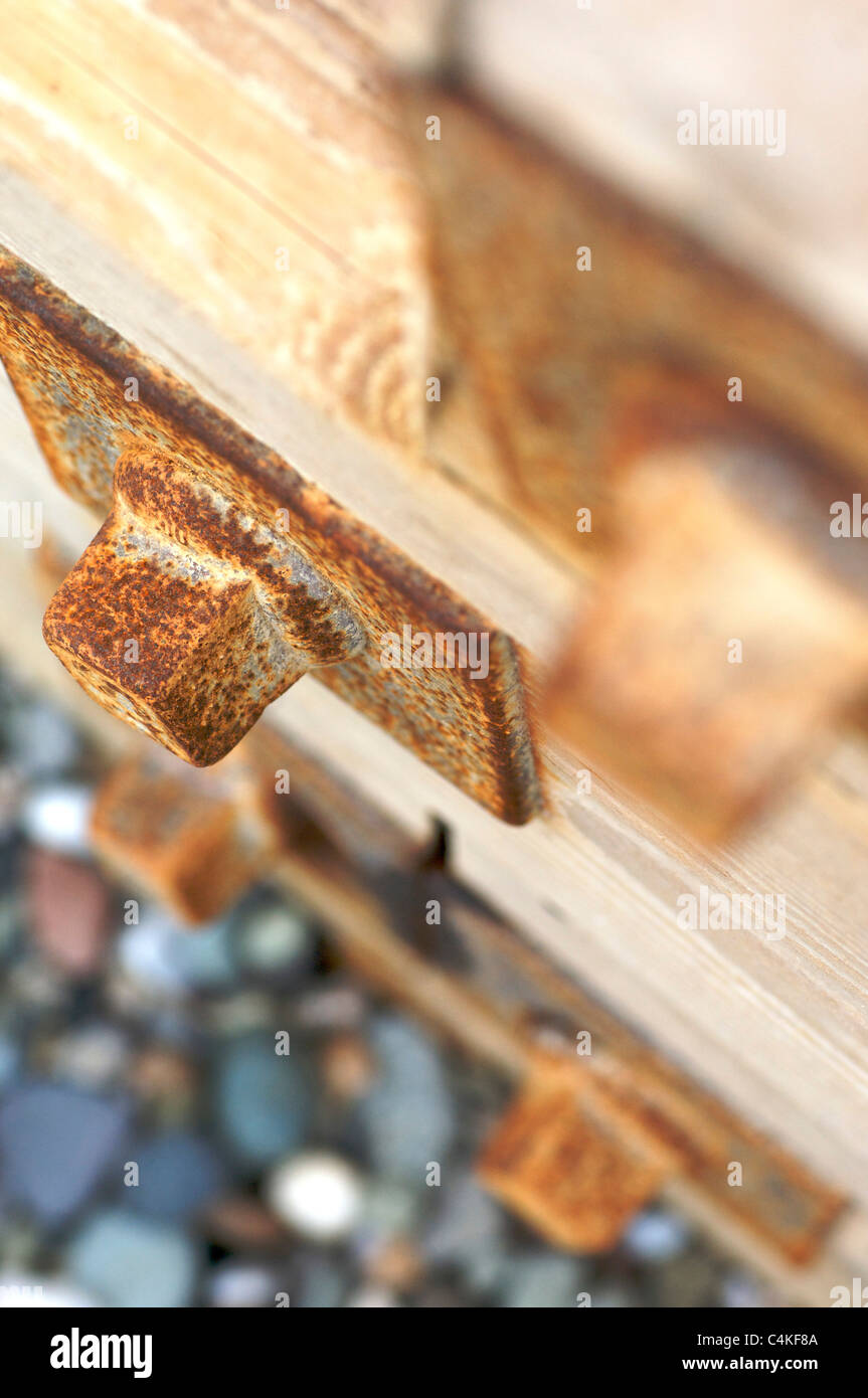 Nuts and bolts holding beach groyne together Stock Photo Alamy