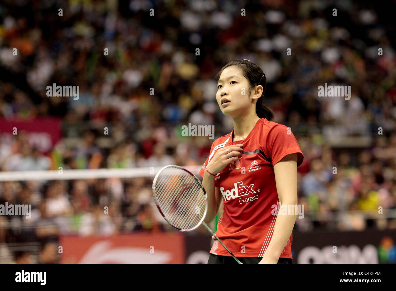 Wang Xin of China during her Women's Singles Semi-finals match of the Li-Ning Singapore Open 2011. Stock Photo