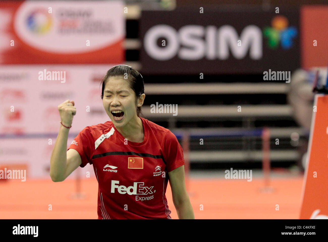 Wang Xin of China in action during her Women's Singles Finals of the Li-Ning Singapore Open 2011. Stock Photo