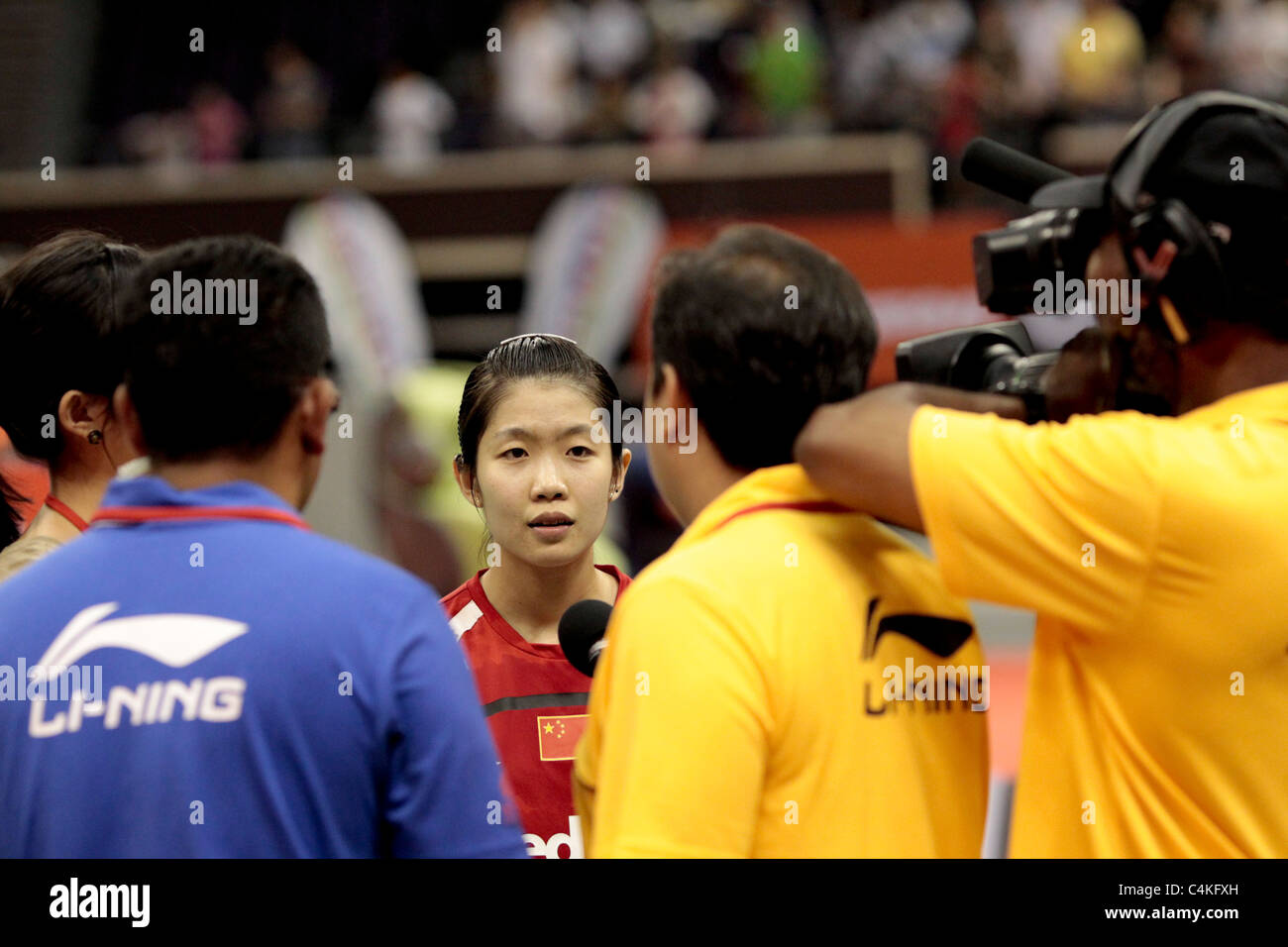 Wang Xin of China in action during her Women's Singles Finals of the Li-Ning Singapore Open 2011. Stock Photo