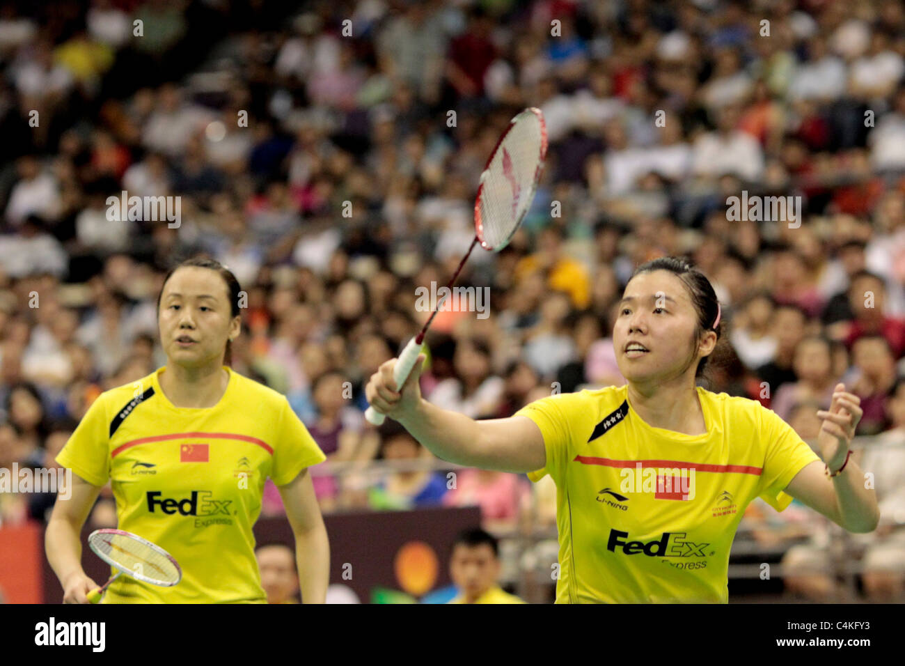 Zhao Yunlei and Tian Qing of China in action during their Women's Doubles Finals of the Li-Ning Singapore Open 2011. Stock Photo