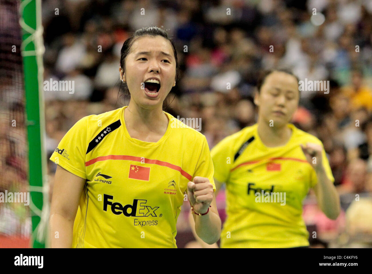 Zhao Yunlei and Tian Qing of China in action during their Women's Doubles Finals of the Li-Ning Singapore Open 2011. Stock Photo