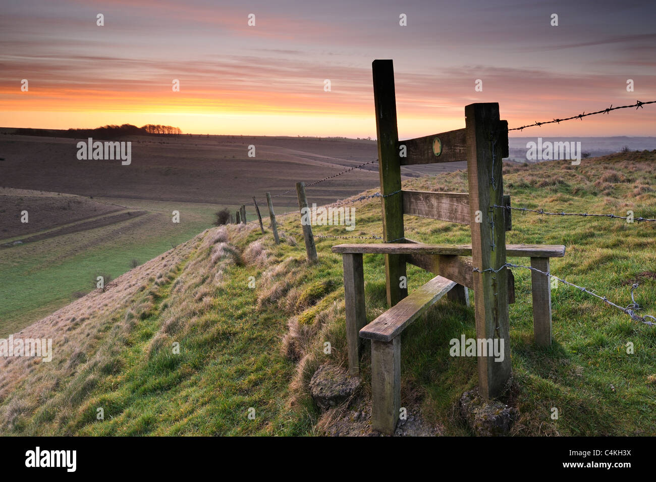 A stile on a hillside on the Deverills near Mere, Wiltshire. Stock Photo