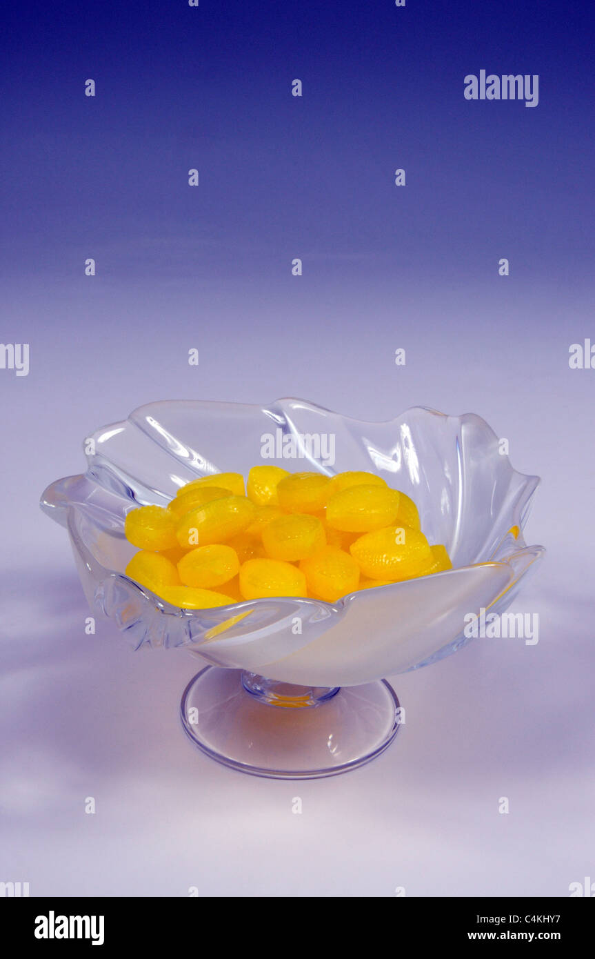 Frosted glass dish with Sherbet Lemons, Urb. Calypso, Costa del Sol, Malaga Province, Andalucia, Spain, Western Europe. Stock Photo