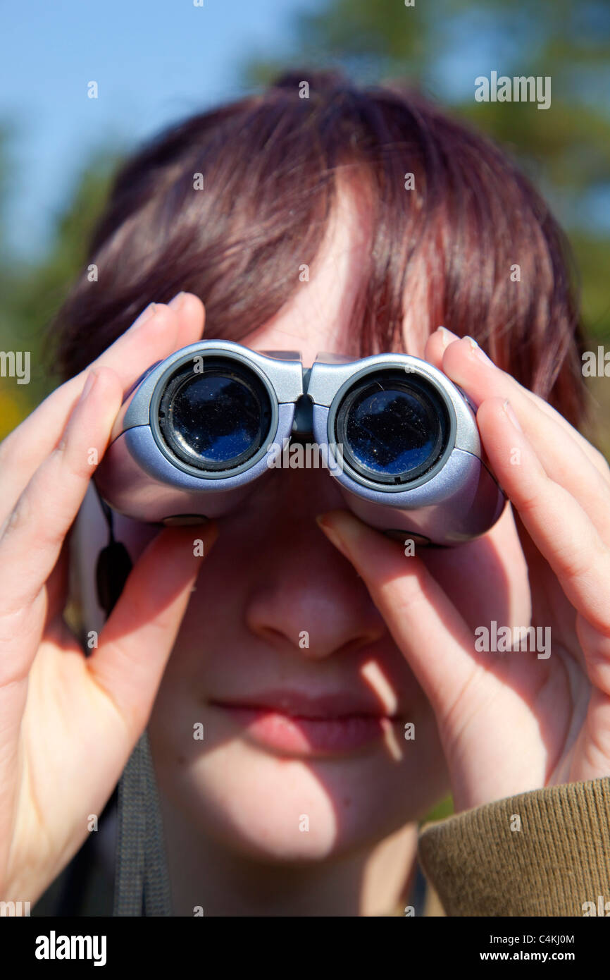 Girl bird watching; Cornwall Stock Photo