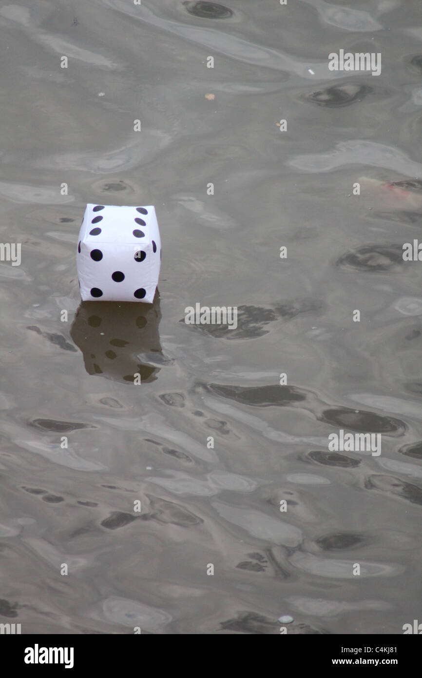 Inflatable dice floats on water Stock Photo - Alamy