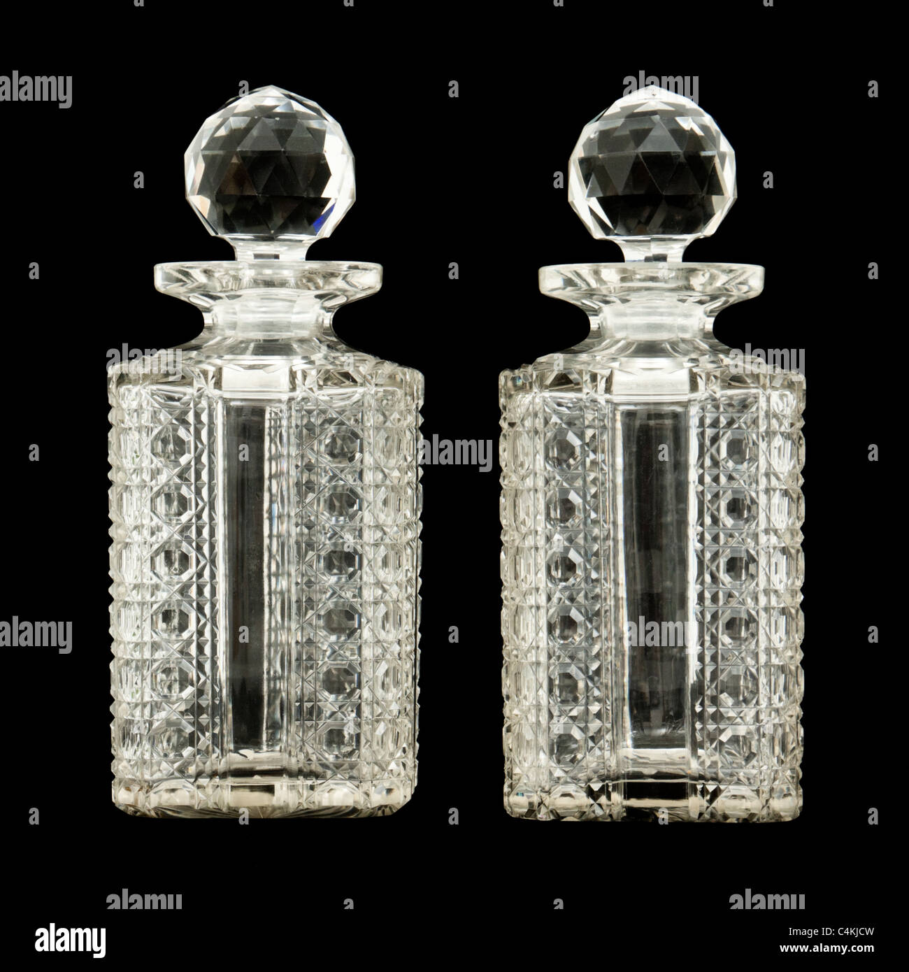 Pair of antique crystal / cut glass whiskey decanters Stock Photo