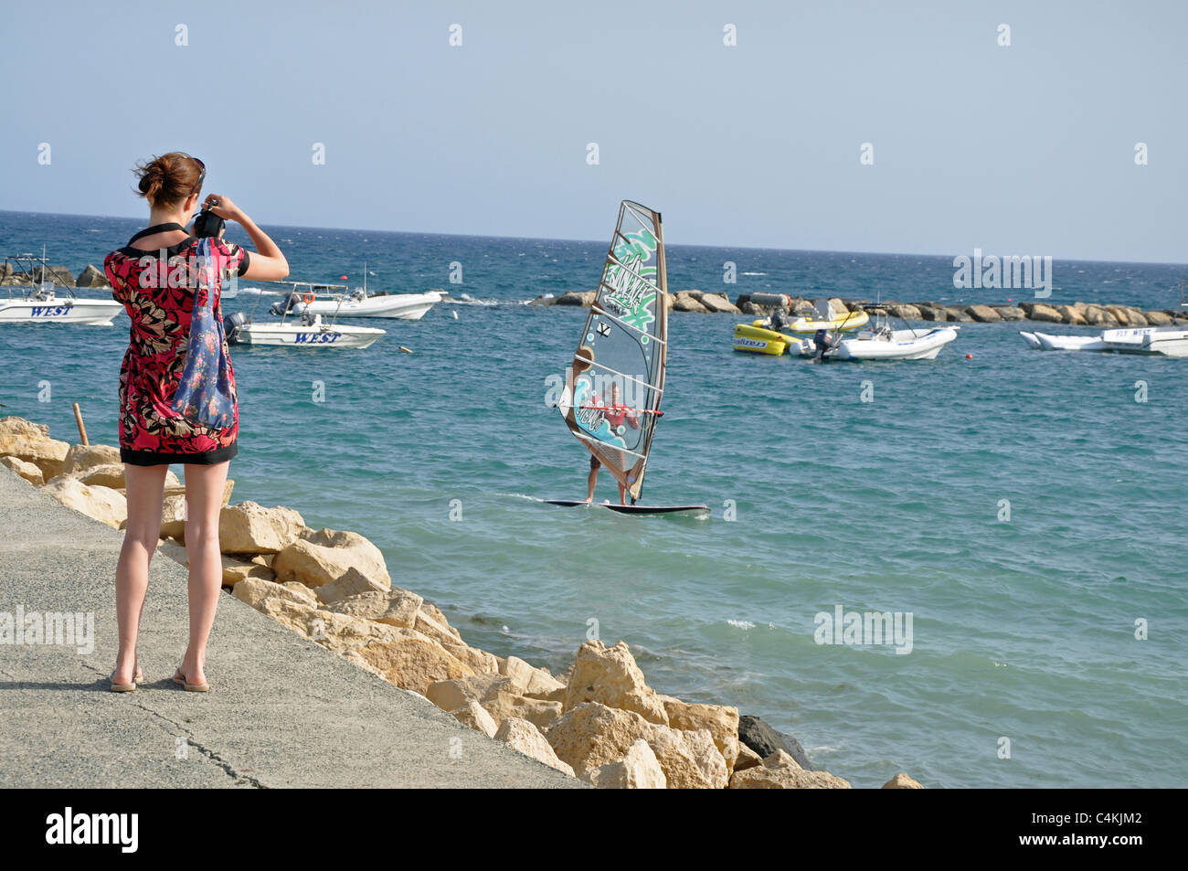 Tourist taking photos on Limassol coast southern Cyprus Stock Photo