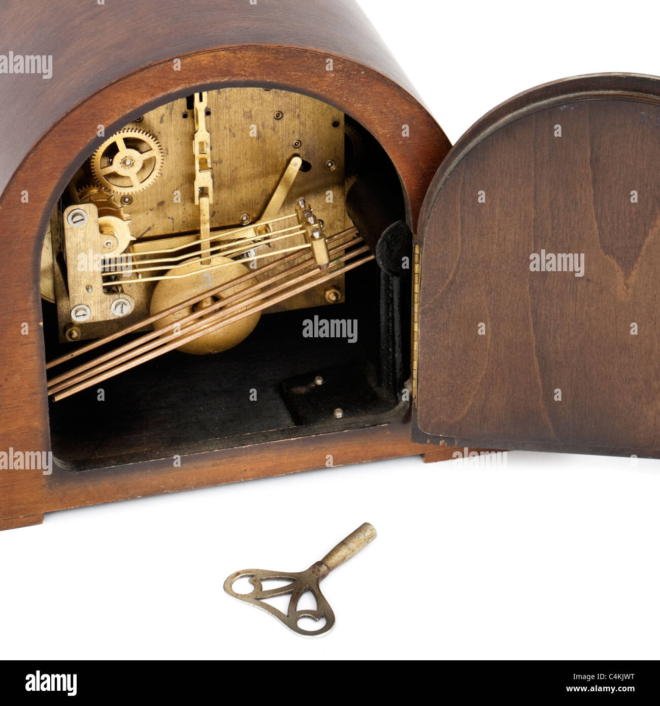 Internal mechanism of vintage Bentima Westminster chime mantel clock with winding key Stock Photo