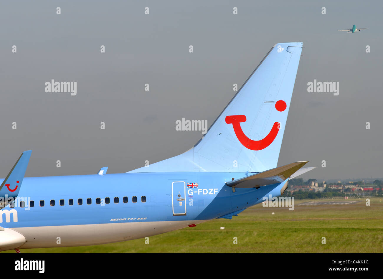 Tui logo on Thomson Boeing 737 aircraft tail, Birmingham Airport, UK Stock Photo