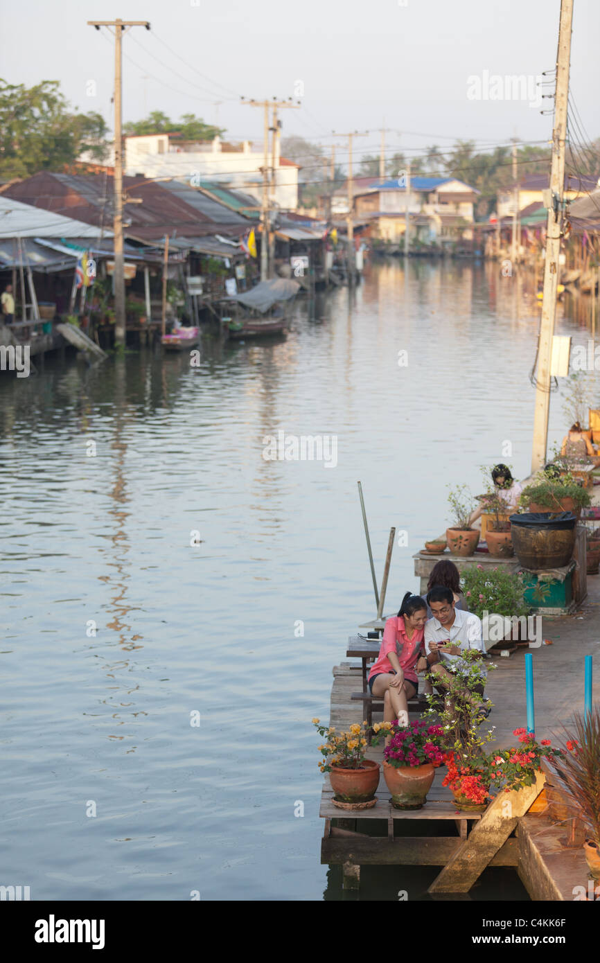 Thai Couple Sitting Amphawa Floating Market Early In The Morning