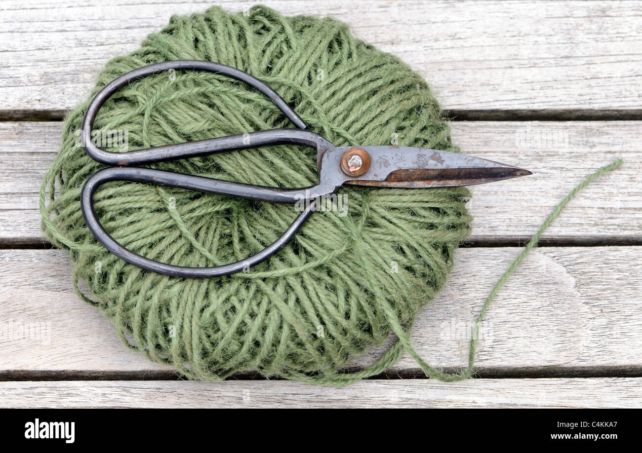 A roll of garden string with japanese scissors Stock Photo Alamy