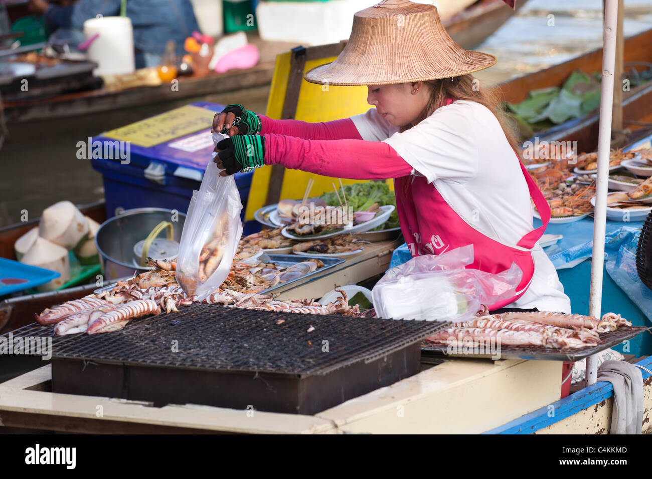 Thai Woman Preparing And Selling Seafood In Amphawa Floating