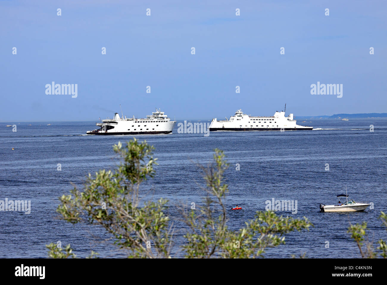 Car and passenger ferries passing each other on Long Island Sound