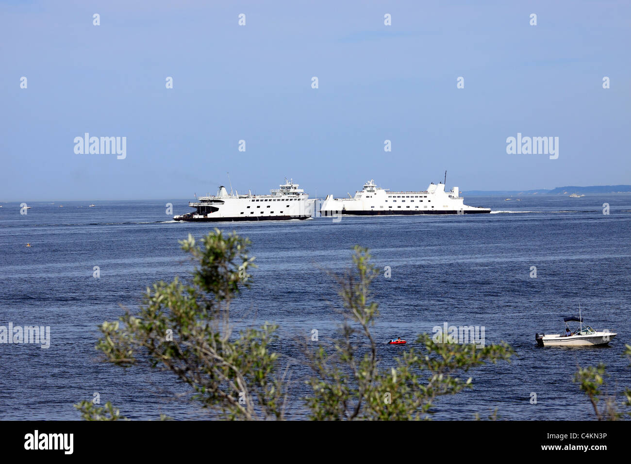 Car and passenger ferries passing each other on Long Island Sound
