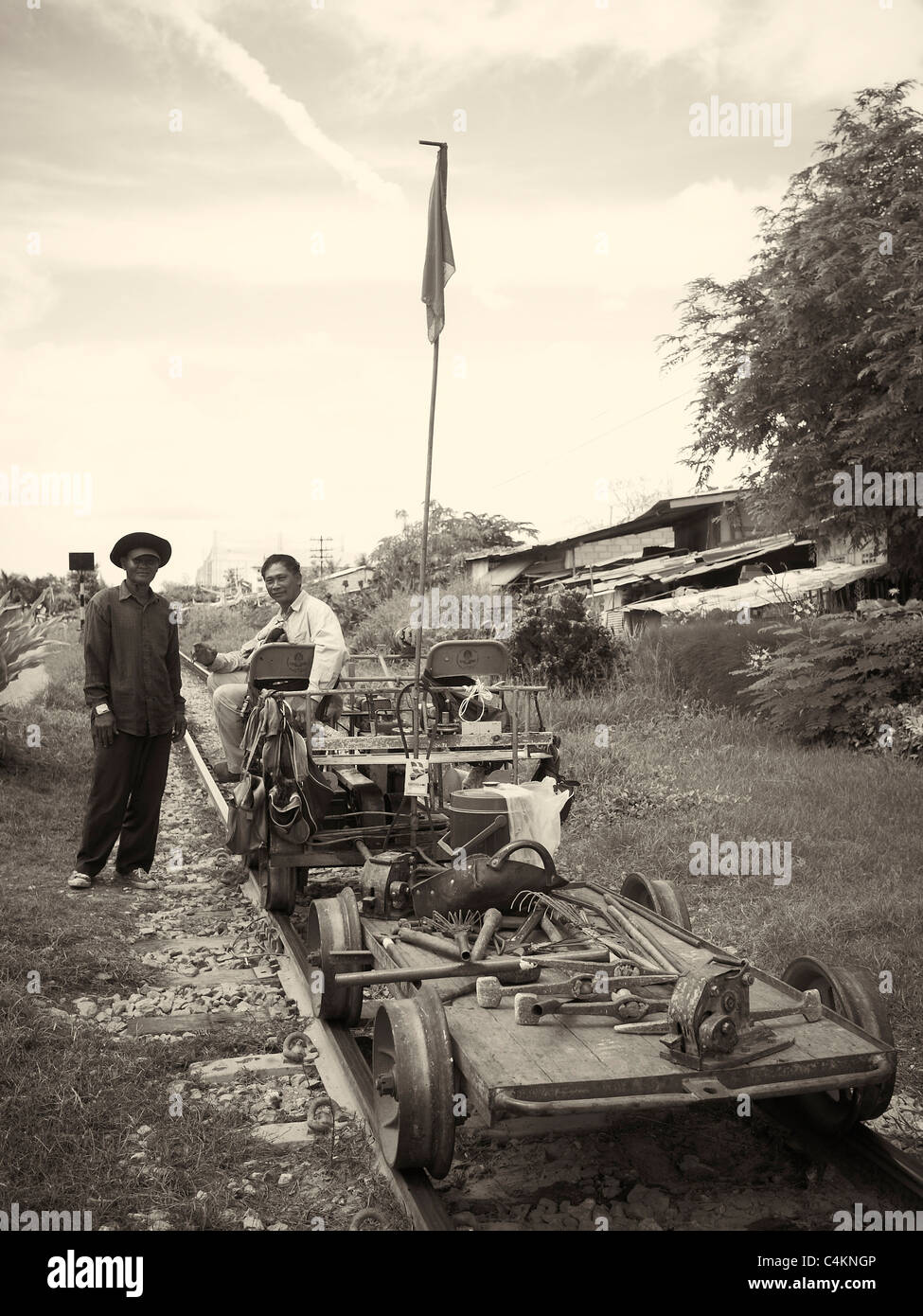 Vintage photograph of old time railway workers. Thailand S. E. Asia Black and white photography Stock Photo