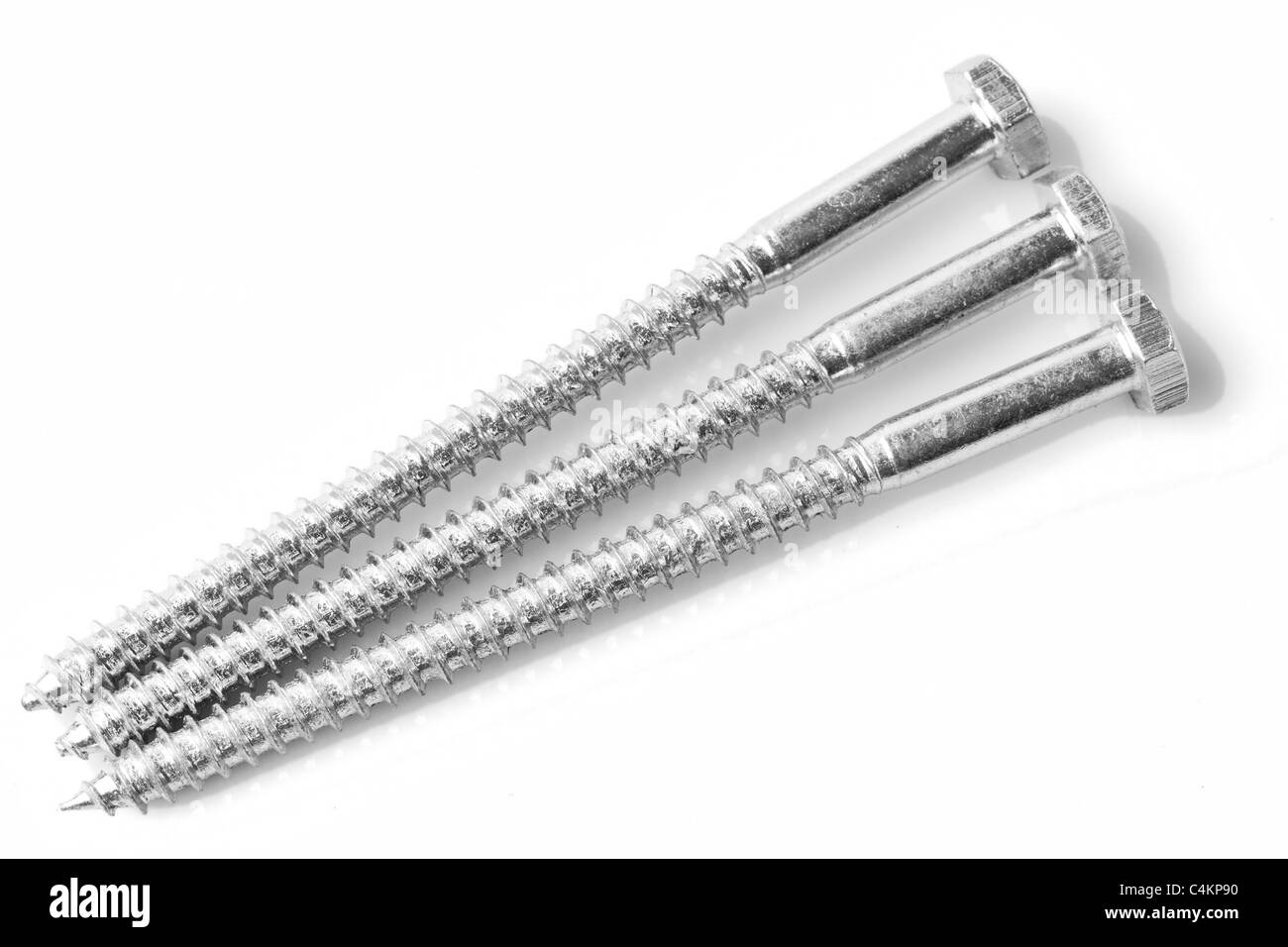 Set Of Three Hexagonal Screws Isolated On White Studio Shot Stock Photo