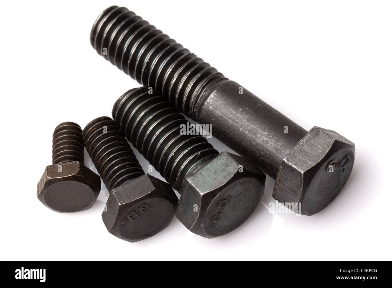 Set Of Four Different Sizes Of Screws Studio Isolated Shot Stock Photo