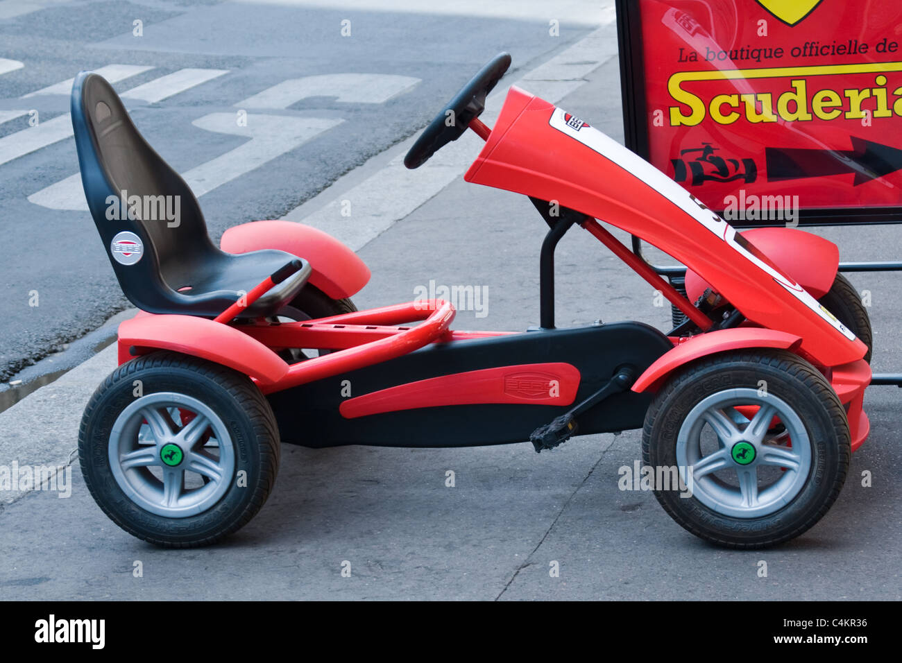 A child's Ferrari plastic peddle go-cart kart View from the side. Close up  Stock Photo - Alamy
