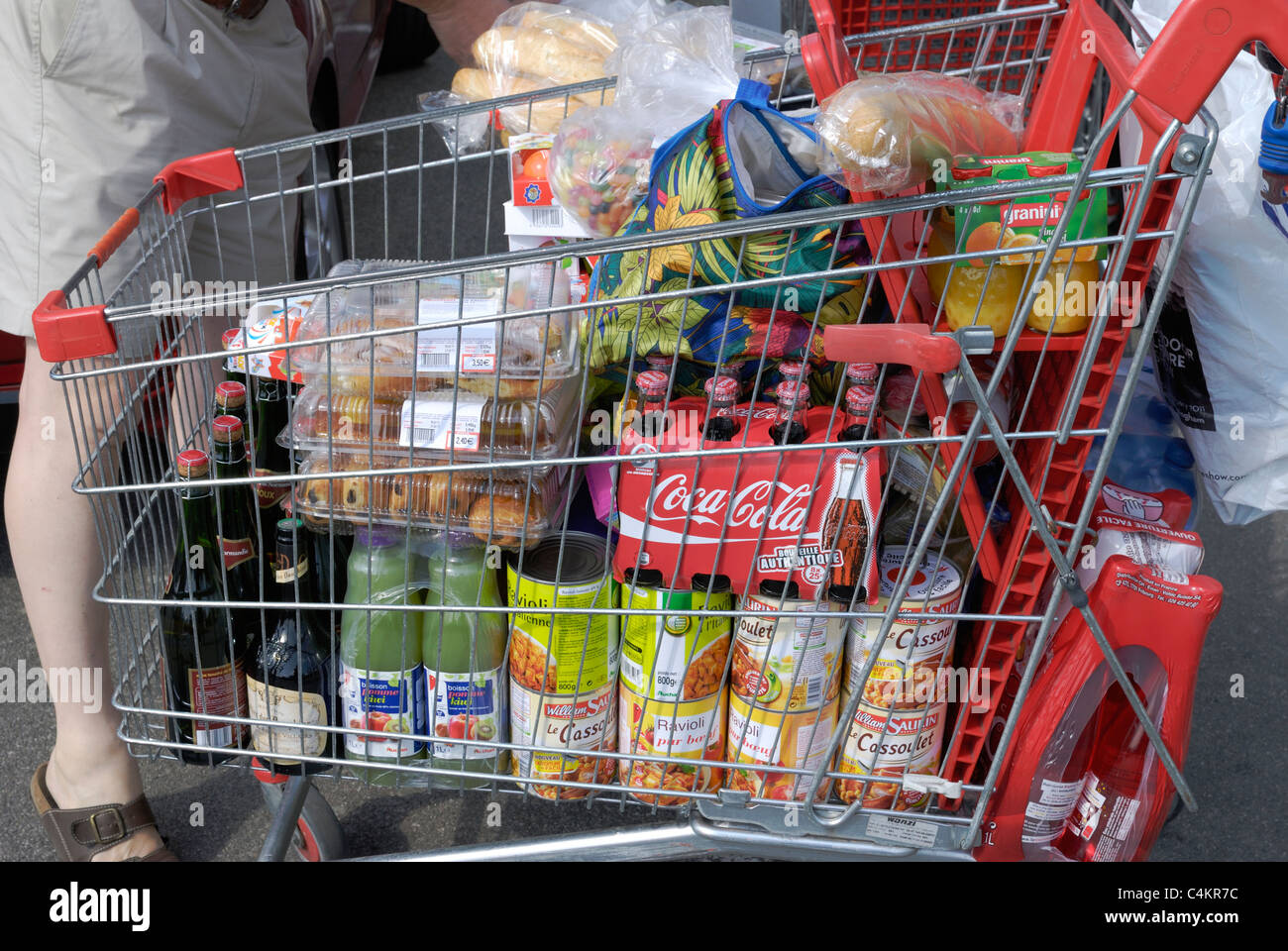 Shopping trolley completely full of mixed goods. Auchan hypermarket at  Bolougne. Pas de Calais. France Stock Photo - Alamy