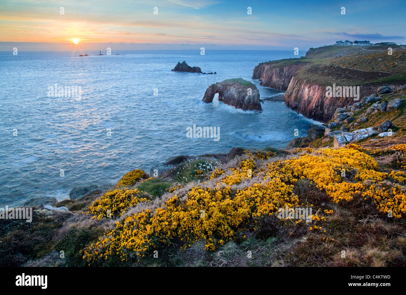 Land's End looking towards Longships Lighthouse at sunset; Cornwall Stock Photo
