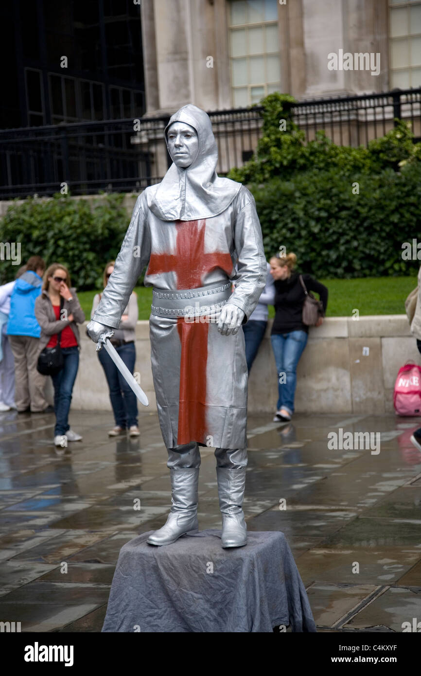 Silver painted street performer entertainer hires stock photography