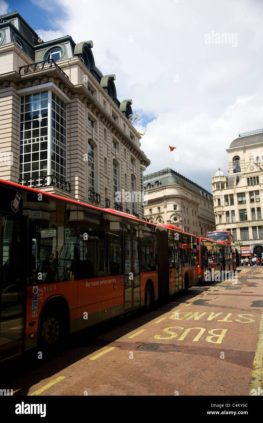 Long Bus Queue on Haymarket in London Stock Photo Alamy