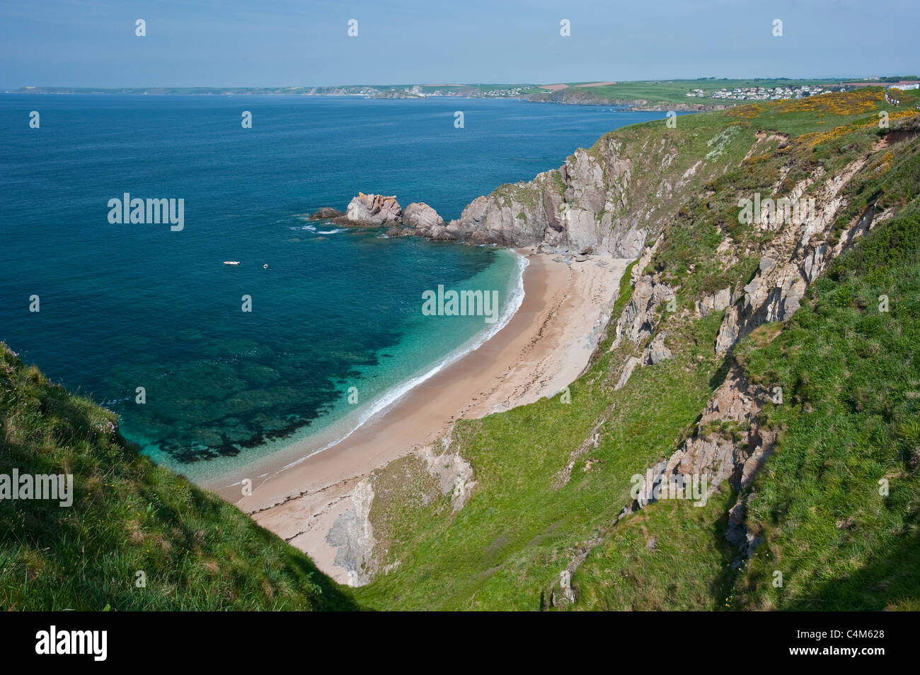 Beacon Point in Devon showing this sandy beach inlet and rugged natural