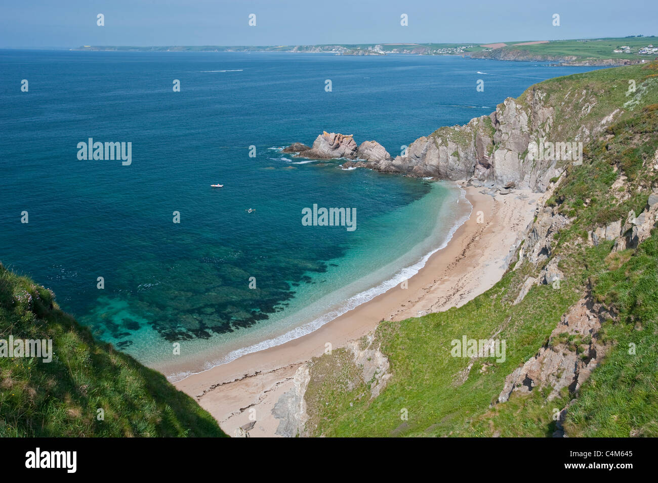 Beacon Point in Devon showing this sandy beach inlet and rugged natural