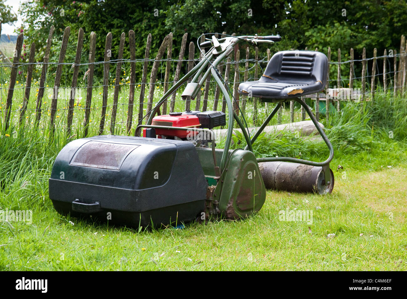 Traditional ride on rotary lawnmower, Hampshire, England, United Kingdom. Stock Photo