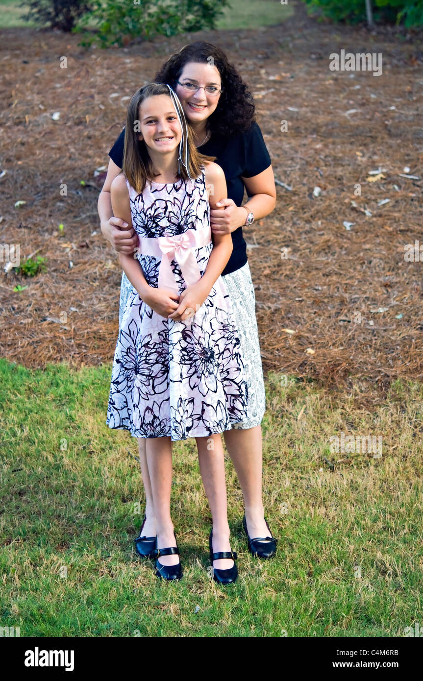 Mother and daughter ready to go to middle school graduation, prom or any other special event. Stock Photo