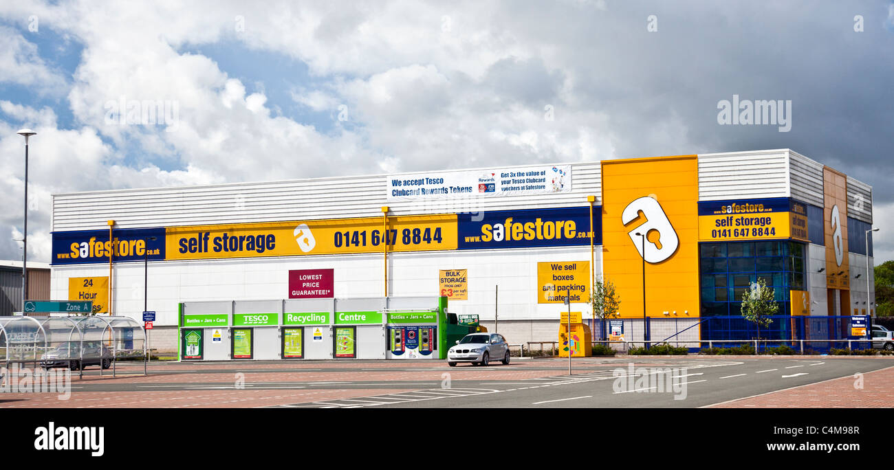 Safestore self-storage facility in Rutherglen Retail park on the outskirts of Glasgow. Tesco recycling bins in the car park. Stock Photo