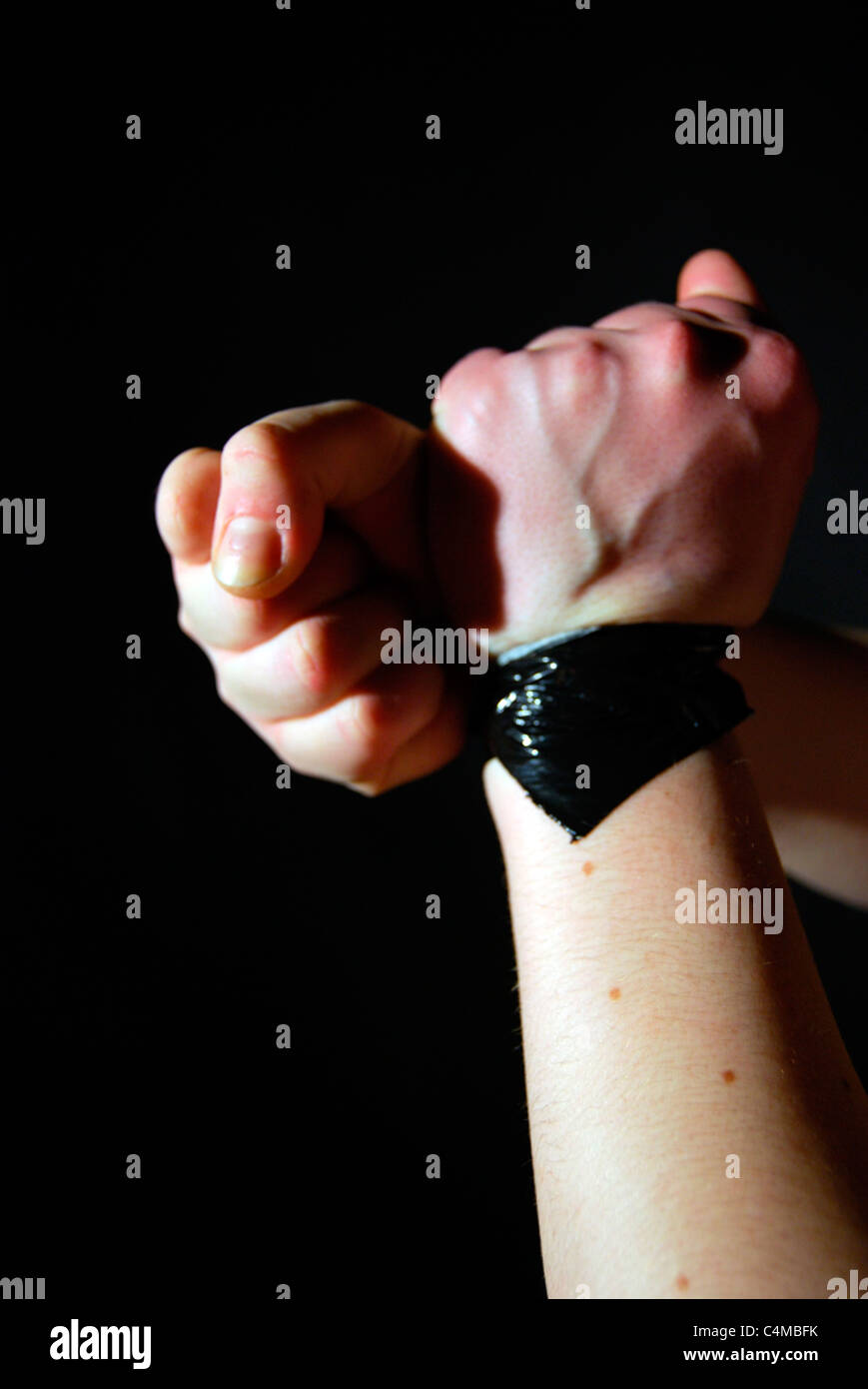 bound hands fists Stock Photo